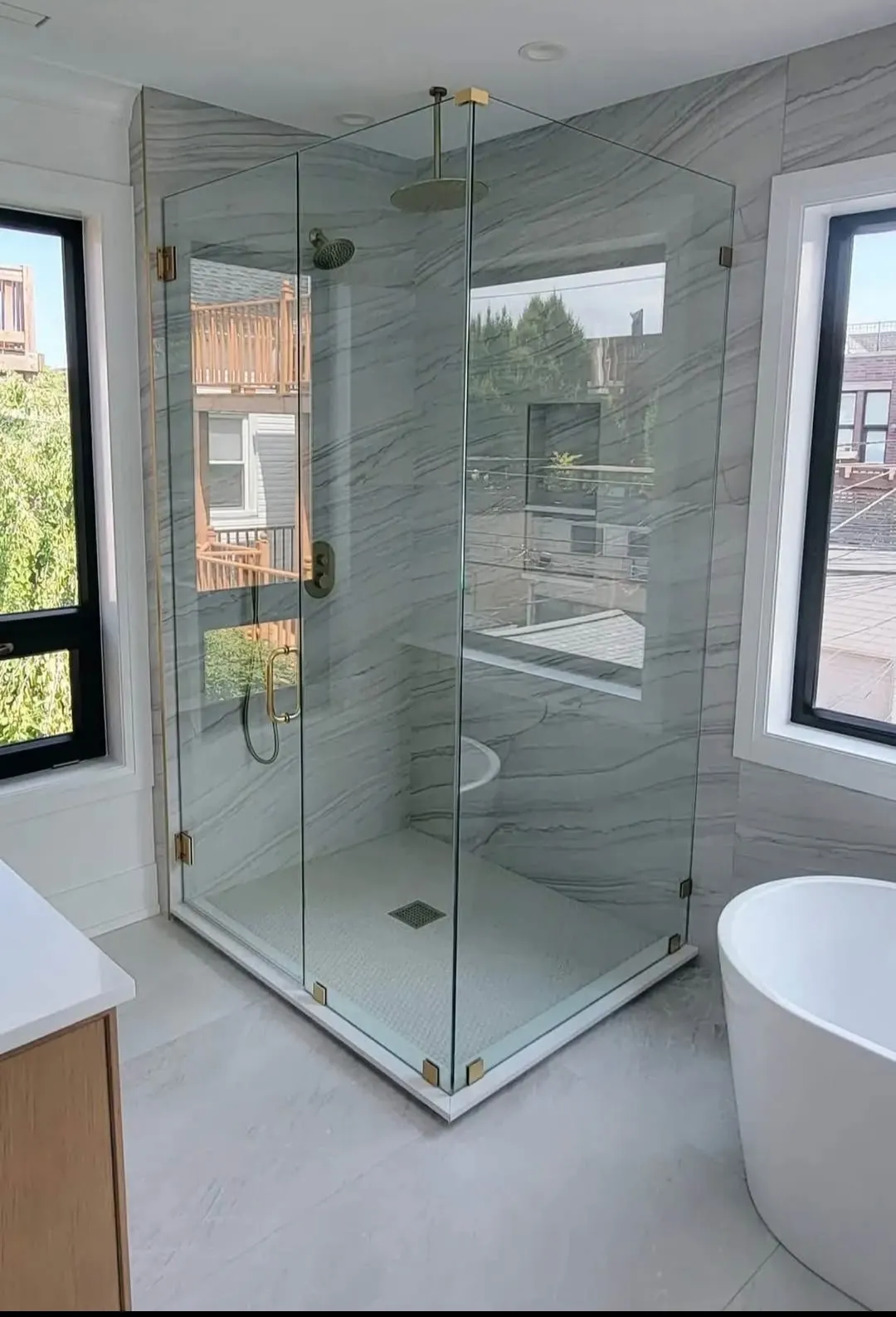 Bathroom remodel with frameless glass corner shower and freestanding tub in Bloomingdale
