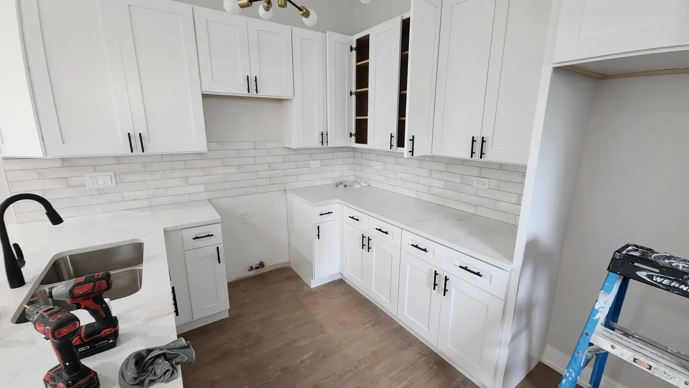 Kitchen remodel with new white shaker cabinets and subway tile backsplash in Bloomingdale