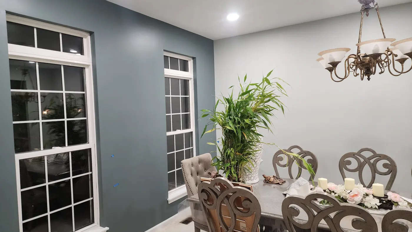 Freshly painted gray-blue dining room walls in Bloomingdale home