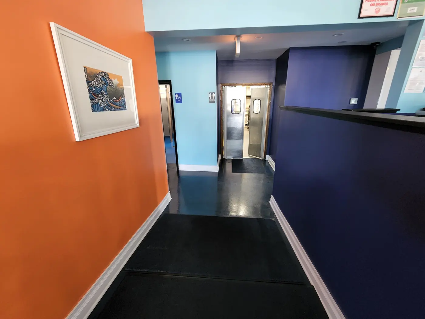 Smooth multi-coat orange and navy wall finish in Bloomingdale
