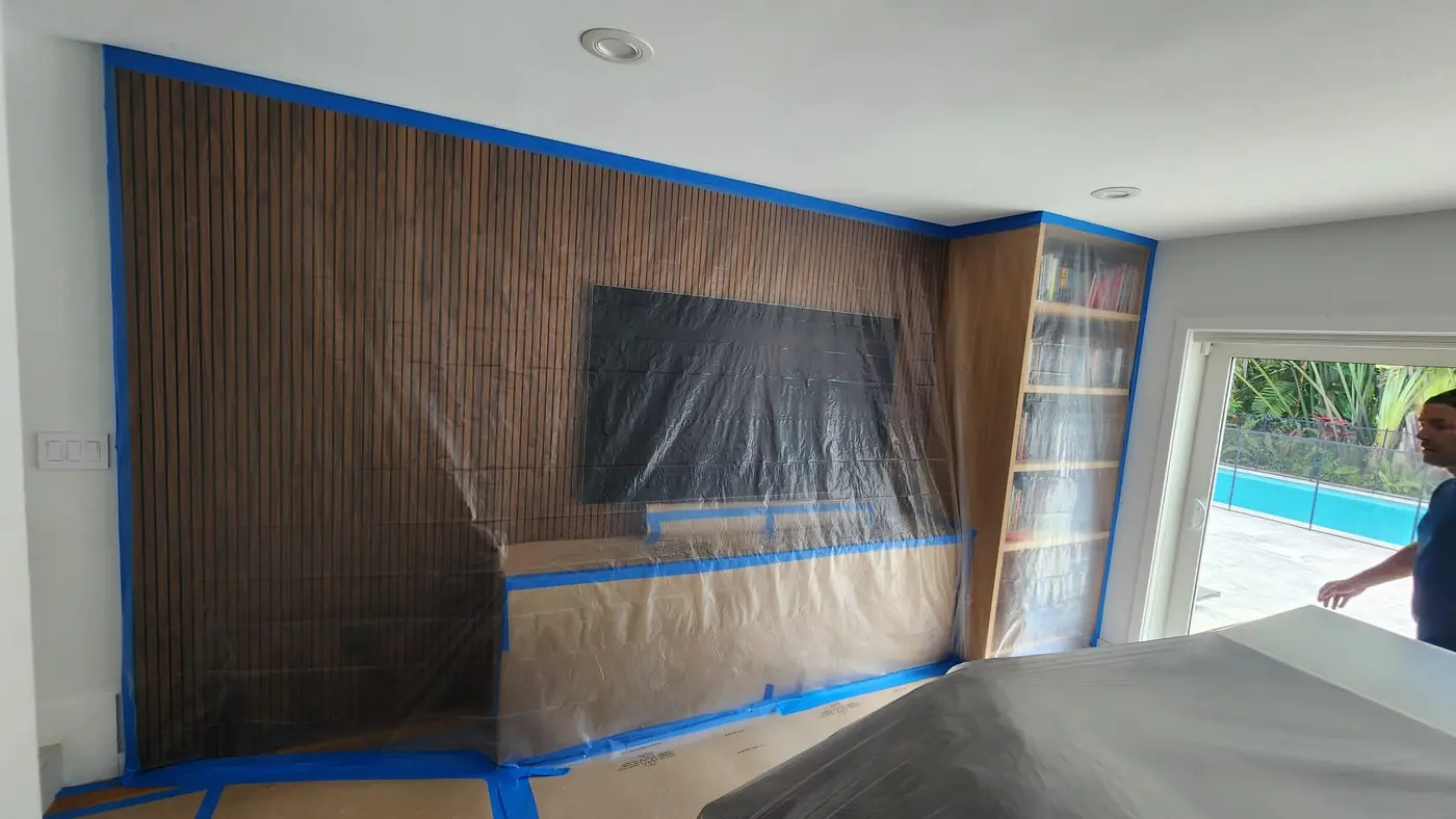 Interior wall masked and protected with painter tape and plastic before painting in Bloomingdale